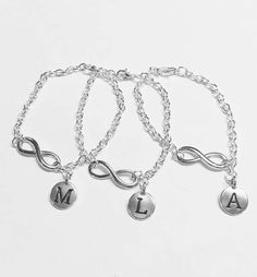 This is a very stylish infinity charm bracelet set. The infinity charm is silver tone and approx 1". Round letter charm approx 16.5mm x 12mm (letter charms are Pewter). The bracelet closes with a lobster clasp. You can get this bracelet in a 6, 7, 8, 9, 10, 11, 12"( these make great ankle bracelets as well) length. Please leave a note at checkout for the length you would like the bracelet to be. If no note is left, a 7" bracelet will be sent. Chain made of silver plated alloy. Listing includes 3