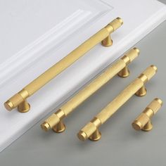 four brass door handles and two knobs