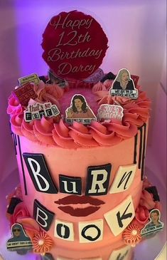 a birthday cake with lots of stickers on it and the words burn book spelled out