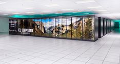 an empty room with several large pictures on the wall and tiled flooring in front of it