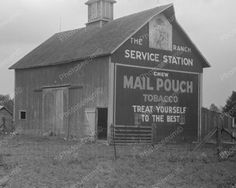 an old black and white photo of a mail pouch building