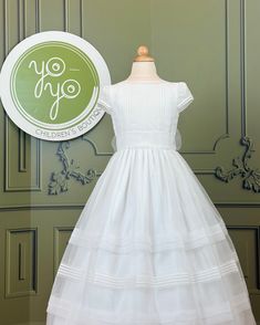 Mia is a coquette first communion dress made with off-white organza, it has super dainty lace on the chest and sleeves. Made in Spain Does not include crinoline Dry Clean 100% polyester Final sale, no exchanges nor returns will be accepted after purchase Fitted Tulle First Communion Dress With Ruffles, Short Sleeve Dress With Fitted Bodice For Confirmation, Elegant First Communion Dress With Short Sleeves, Confirmation Gown With Fitted Bodice And Tulle, Fitted Tulle Gown For Confirmation, Elegant First Communion Dress With Fitted Bodice, Tulle Gown With Fitted Bodice For Confirmation, Elegant Short Sleeve First Communion Dress With Fitted Bodice, Fitted Short Sleeve First Communion Dress