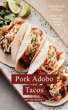 pork adobo tacos on a plate with limes and cilantro