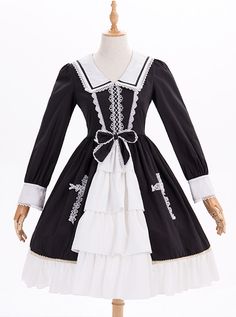 Black And White Bowknot Lace Crucifix Gothic Lolita Lapel Long Sleeve Dress Black Long Sleeve Vintage Dress For Costume, Black Bow Dress For Costume Party, Black Dress With Bow For Costume Party, Black Victorian Dress With Lace Trim For Costume, Black Victorian Dress For Cosplay, Black Long Sleeve Vintage Costume Dress, Gothic Doll Collar Dress For Costumes, Gothic Doll Collar Costume Dress, Black Gothic Victorian Dress With Lace Trim