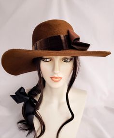 "ONE OF A KIND" Hand blocked mousseline millinery felt hat in fabulous boho style! Dramatic warm brown color and a texture that is so luscious and soft. It has a longer nap than most velour felts.  Oval crown with a bit of a bowler shape to it. Decorated with stunning vintage velvet ribbon that was Made in France. Lovely 4" sweeping brim.   Head size is 22"-22.5" Ships FREE UPS ground. This is a 25.00 savings! Brown Curved Brim Top Hat For Kentucky Derby, Kentucky Derby Wide Brim Fur Felt Top Hat, Elegant Brown Fedora For Kentucky Derby, Elegant Brimmed Boater Hat For Country Events, Elegant Wide Brim Boater Hat For Country Events, Chic Brown Hats For Kentucky Derby, Brown Short Brim Felt Hat For Kentucky Derby, Fur Felt Boater Hat For Kentucky Derby, Elegant Brown Hat Bands For Kentucky Derby