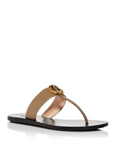 Gucci Designer Sandals With Single Toe Strap, Designer Gucci Sandals With Single Toe Strap, Chic Gucci Sandals With Single Toe Strap, Gucci Luxury Sandals For Summer, Luxury Gucci Sandals For Summer, Luxury T-strap Sandals For Beach, Elegant Gucci Flat Sandals, Luxury T-strap Beach Sandals, Designer Toe Post Sandals