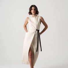 Stay chic and comfortable all day long with the Aurore Linen Midi Dress in Black. Dyed in a versatile earthy tone that’s cut from an innovative stretch linen for optimal comfort and fit. Elegant High Neck Maxi Dress For Work, Formal Beige Dress With Asymmetrical Hem, Spring High-neck Dress With Side Slits, Elegant Beige Maxi Sleeveless Dress, Spring High Neck Dress With Side Slits, Chic Fitted Beige Asymmetrical Dress, Chic Beige High Neck Dress, Chic High Neck Beige Dress, Elegant Beige Sleeveless Asymmetrical Dress