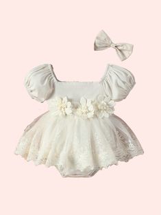 Dress your little princess in enchanting style with our Baby Girl's Bubble-Sleeve Mesh Romper With Flower Applique Skirt And Headband! This delightful ensemble combines whimsy and elegance, featuring a mesh romper with charming bubble sleeves and a flower applique skirt for added flair. Complete with a coordinating hea