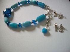 "This ocean blue bracelet is 7.5\" inches in length and has a 1\" inch extender to lengthen the bracelet. The ocean blue beads range in color from a light blue to a deep ocean water blue. A perfect bracelet if you have a slightly larger wrist. It adjusts from 7.5 to 8.5\" inches. The clasp is sterling silver. Gift box included.  For personalization: Choose up to 2 letters (initials of a name) XO  etc." Blue Adjustable Charm Bracelet With Lobster Clasp, Blue Bracelets With Extender As Gift, Blue Beaded Bracelets With Lobster Clasp, Blue Beaded Bracelets With Extender, Adjustable Blue Jewelry With Extender, Blue Beaded Bracelets, Holiday Wrapping Paper, Water Blue, Deep Ocean