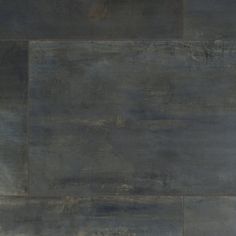 a black and grey tile floor that looks like it is made out of wood or concrete