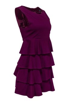 Get fancy with this sleeveless burgundy dress from Theory. A flounce tiered skirt provides a fun and flattering silhouette, while buttons in the back add uniqueness. Style with a pair of black heels and you're good to go! Size S Shell: 71% Viscose, 23% Polyamide, 6% Elastane Lining: 94% Polyester, 6% Spandex Made in USA Oversized button-down back closure Lined Shift silhouette Round neckline Sleeveless Tiered flounce skirt Bust 34” Waist 34” Shoulder to hem 33.5” Elegant Purple Tiered Dress, Purple Fitted Tiered Mini Dress, Burgundy Ruffled Dress For Night Out, Fitted Purple Tiered Mini Dress, Burgundy Sleeveless Ruffled Dress, Fitted Purple Ruffle Dress With Ruffle Hem, Fitted Tiered Dress For Date Night, Burgundy Sleeveless Dress With Ruffles, Party Sleeveless Dress With Ruffle Hem And Tiered Shape