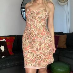 Vintage 90/00's silk paisley floral dress.  So cute with adjustable tie detail at the bust which is super flattering on the chest.  Size 4 and best for an xs/small.  Was very tight in my chest area and I am a small/medium.  100% silk outer with polyester lining.  I am 5'4 for reference! Ships within 48 hours. Please message me with any questions! Fitted Silk Dress With Paisley Print, Paisley Print Mini Dress For Summer Party, Summer Paisley Print Mini Dress For Party, Summer Party Mini Dress With Paisley Print, Chic Fitted Paisley Print Mini Dress, Summer Silk Dress With Paisley Print, Spring Paisley Print Fitted Mini Dress, Spring Fitted Mini Dress With Paisley Print, Fitted Paisley Print Mini Dress For Spring