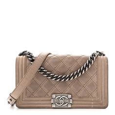 This is an authentic CHANEL Calfskin Quilted Double Stitch Medium Boy Flap in Brown. This chic cross-body bag is crafted of calfskin leather with a diamond stitch, embossed stitching accents, and a peripheral framed quilting. The bag features ruthenium adjustable chain link shoulder straps with a shoulder pad with a facing ruthenium Chanel boy CC push lock. The front flap opens to a black fabric interior with a patch pocket. Quilted Wallet, Velvet Quilt, Chanel Shoulder Bag, Heart Bag, Chanel Model, Stylish Shoulder Bag, Chanel Caviar, Chanel Boy, Quilted Leather