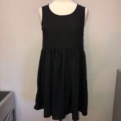 Nwt Brandy Melville Semi Sheer Babydoll Dress Brandy Melville New With Tag Never Worn Size: One Size Color: Black Semi Sheer Sleeveless Lace Open Back Babydoll Dress No Returns. Thank You And Have An Amazing Day! Black Flowy Sleeveless Casual Dress, Casual Black Sleeveless Flowy Dress, Black Flowy A-line Mini Dress, Black A-line Flowy Mini Dress, Casual Black Sleeveless Lined Dress, Casual Black Lined Sleeveless Dress, Black Lined Mini Dress For Daywear, Black Lined Dress For Daywear, Amara Dress Brandy Melville