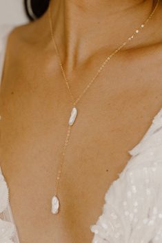 Elevate your jewelry collection with our new Kiara Pearl Y Necklace! Each piece is lovingly handcrafted with freshwater biwa stick pearls, known for their unique and organic shapes, making every necklace truly one-of-a-kind! The delicate yet durable cable chain is available in your choice of 14k gold filled, rose gold filled, or sterling silver, providing you with a luxurious and versatile accessory that will complement any outfit. Make a beautiful statement with the Kiara Pearl Y Necklace! NECK Long Drop Pearl Charm Necklace As Gift, Long Drop Pearl Charm Necklace For Gift, Gift Long Drop Pearl Charm Necklaces, V Neck Necklace Guide, Long Drop Pearl Necklace With Adjustable Chain As Gift, Pearl Lariat Necklace As A Gift, Long Drop Pearl Necklace With Pendant For Gift, Long Drop Pearl Pendant Necklace As Gift, Long Drop Pearl Drop Necklace As Gift