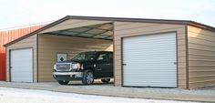 a truck is parked in front of a garage with two doors on the side of it