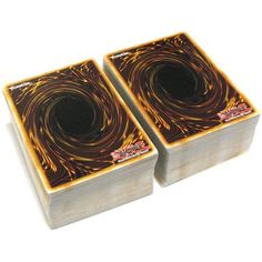 two square coasters with swirl designs on them