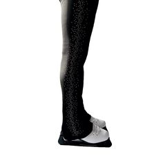 a woman in black and white tights with stars on her leg, standing up