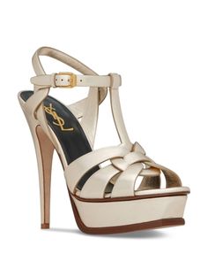 Saint Laurent Tribute Sandals in Metallic Leather High-end Open Toe Summer Sandals, High-end Open Toe Sandals For Summer, Luxury Open Toe Platform Sandals, Luxury T-strap Heels For Summer, Elegant Leather T-strap Sandals, Luxury Gold T-strap Sandals, Luxury Platform Sandals With Open Heel, Luxury Open Heel Platform Sandals, Luxury Open Toe Sandals With Padded Heel