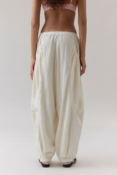 Drapey BDG Em balloon pants. Crafted from a gauzy linen-blend fabric and cut in a drapey fit with a low-rise, a baggy balloon silhouette through the legs and cinched hems. Finished with lots of side pockets. Urban Outfitters exclusive. Features BDG Em Linen Balloon Pant Drapey jogger-style pants Linen-blend fabric Low-rise fit Pockets at the sides UO exclusive Content + Care 52% Rayon, 48% linen Machine wash Imported Size + Fit Model in Black is 5'9" and wearing size Small Measurements taken fro Low Rise Linen Pants, Western Blouses, Modern Blouse Designs, Balloon Silhouette, Western Blouse, Blouses Designs, Collection Ideas, Pants Linen, Balloon Pants