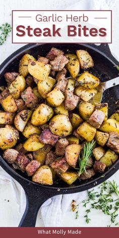 garlic herb steak bites in a cast iron skillet with rosemary garnish on the side