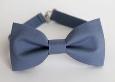 a blue bow tie on a white background