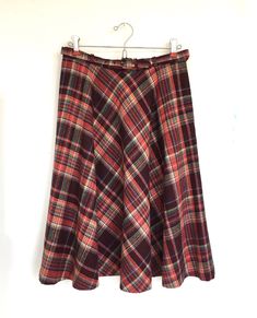 "Vintage Joyce Sportswear plaid full skirt with belt 2 button side closure with pocket Maroon, red, blue, green & cream plaid No size tag- fits like a small- you could re-sew buttons if you want to adjust waist Please check measurements below and compare to a favorite skirt No fiber tag- feels like a wool blend- tag marked dry clean only Tag marked: Int Ladies Garment Workers Union- Union Made ILGWU- Made in USA- Thank you for buying American made apparel Measurements taken while laying flat: Wa Red Flared Skirt For Fall, Red Lined Skirt For Fall, Plaid Lined Skirt For Winter, Red Skirted Bottoms For Fall, Plaid A-line Skirt With Lining, Plaid Skirted Bottoms For Fall, Red Full Skirt Bottoms For Fall, Red Knee-length Bottoms For Fall, Red Full Skirt For Fall