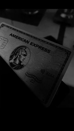 an american express credit card is shown in black and white