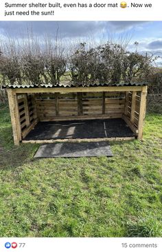 a wooden shelter with plants growing out of it's roof and the words summer shelter, even has a door that now we just need to open