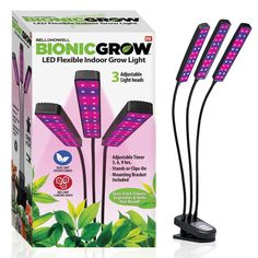 three grow lights in front of a box