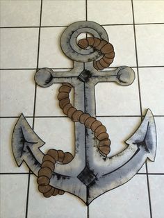 an anchor is painted on the tile floor