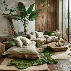 a living room filled with lots of furniture and plants on top of the rugs