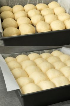 two pans filled with dough sitting on top of a counter next to each other