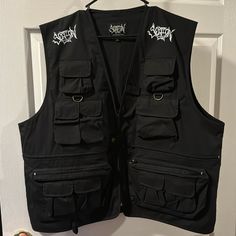 Xl Section Eight “Joey Jordison” Black Tactical Vest Brand New Black Techwear Vest With Multiple Pockets, Black Utility Vest For Outdoor Activities, Black Vest With Multiple Pockets For Streetwear, Black Streetwear Vest With Multiple Pockets, Tactical Outerwear With Cargo Pockets For Hiking, Tactical Hiking Outerwear With Cargo Pockets, Black Techwear Vest With Cargo Pockets, Black Utility Vest With Cargo Pockets, Military Black Outerwear For Hunting