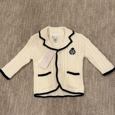 Nwt Ralph Lauren Baby Cable Knit Button Up Sweater. White With Navy Trim And Crest. Smoke Free/Pet Free. Cute White Outerwear With Buttons, White Cute Outerwear With Buttons, White Long Sleeve Cardigan For Playtime, White Knit Sweater For Playtime, Cute White Sweater With Buttons, White Cardigan For Winter Playtime, White Winter Cardigan For Playtime, Cute White Ralph Lauren Top, Ralph Lauren White Charming Tops