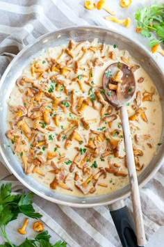 a skillet filled with chicken and gravy