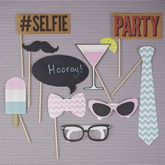 party photo booth props including glasses, mustaches and hats with words selfie party