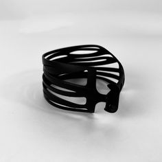 The Kaden & Kai Zebra Wrap Bicycle Tube Bracelet™ is edgy and fun all rolled into one. It looks great with just about everything. The Zebra bracelet is the perfect companion piece for a night out or an afternoon lunch with friends. This distinct cuff bracelet is rapidly becoming one of our best sellers. About Kaden & KaiEvery item in the Kaden & Kai Bicycle Tube Collection is meticulously handcrafted one at time. Our jewelry is eye-catching, lightweight, adjustable and waterproof. Kaden & Kai ma Edgy Adjustable Bangle Bracelet, Adjustable Black Cuff Bracelet For Fashion, Modern Adjustable Bracelet For Fashion, Modern Adjustable Black Wrap Bracelet, Modern Adjustable Bracelet, Modern Cuff Bracelet Bangle As Fashion Accessory, Modern Black Metal Bangle, Modern Cuff Bracelet As Fashion Accessory, Trendy Black Band Bracelets