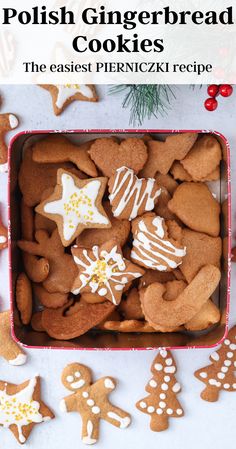 a box full of polish gingerbread cookies with white icing and decorated sugar stars