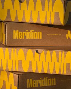 three boxes stacked on top of each other with the word meridian printed on them in yellow and brown