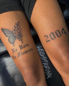 two people with tattoos on their legs, one has a butterfly and the other has flowers