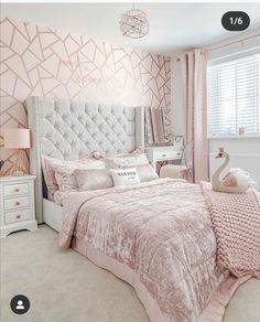 a bedroom decorated in pink and white with a bed, night stand, nightstands and lamps