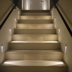 a set of stairs with light coming through them