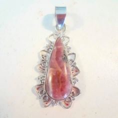 Sterling Silver Rhodochrosite Pendant. No Tags But New, Never Worn. Silver Pink Opal Jewelry Gift, Silver Jewelry With Pink Opal Gemstone, Silver Pink Opal Jewelry For Gift, Pink Sterling Silver Pendant Jewelry, Silver Jewelry With Natural Stones And Rhodonite, Pink Sterling Silver Jewelry With Large Pendant, Silver Rhodonite Jewelry With Natural Stones, Bohemian Pink Pendant Crystal Necklace, Crystal Rhodochrosite