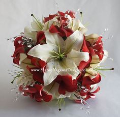 a bridal bouquet with red and white flowers