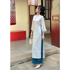 PRODUCT INFORMATION -  Ao dai designed in white color with flowers pattern , traditional and gentle, made of soft cotton material. Designed to be youthful and dynamic. - Style: innovative, straight shape - Application: Suitable for office ladies, parties, weddings, outdoor activities, outdoor photography,... ✅ Ao Dai REFERENCE MEASUREMENT TABLE SIZE | WEIGHT | CHEST | Waist | Butt     S     47-50 kg     85          68      88     M    51-54 kg      88          72       92     L      55-59 kg Traditional White Fitted Cheongsam, Traditional White Cheongsam For Wedding, Traditional White Cheongsam For Spring, White Dress With Traditional Patterns For Spring, White Dresses With Traditional Patterns For Spring, White Long Dress With Traditional Patterns, White Long Sleeve Cheongsam For Wedding, Spring White Dresses With Traditional Patterns, Elegant Long White Ao Dai