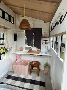 the inside of a mobile home with lots of windows and decor on the outside wall