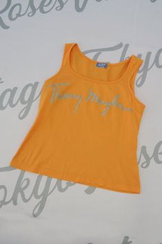 Thierry Mugler Logo Bust Tank Top Sleeveless Shirt Summer Tank Top With Logo Print, Sleeveless Tank Top With Logo Print For Summer, Summer Sleeveless Tank Top With Logo Print, Vintage Yellow Sleeveless Top, Orange Sleeveless Cotton Tank Top, Orange Cotton Sleeveless Tank Top, Orange Sleeveless Cotton Top, Fitted Orange Cotton Tank Top, Casual Orange Cotton Vest