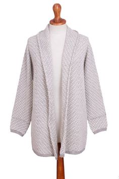 Pia Zavala of Peru designs a cozy long-sleeve relaxed fit cardigan sweater knit with sumptuously soft alpaca blended with acrylic and wool for durability. The sweater has a brick stitch pattern in linen white and pearl grey with an open front shawl collar. The hem and sleeve cuffs are edged in a rib stitch in pearl grey. Long Sleeve Cashmere Outerwear With Jacquard Knit, Cashmere Long Sleeve Jacquard Knit Outerwear, Long Sleeve Cashmere Jacquard Knit Outerwear, Fall Jacquard Knit Cardigan For Layering, Winter Wool Sweater With Open Knit, Jacquard Knit Cardigan For Layering, Cozy Jacquard Knit Cardigan For Fall, Jacquard Knit Outerwear For Layering, Cozy Jacquard Knit Sweater Coat For Winter