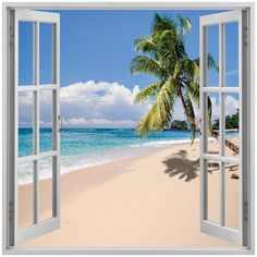 an open window showing the beach and palm tree